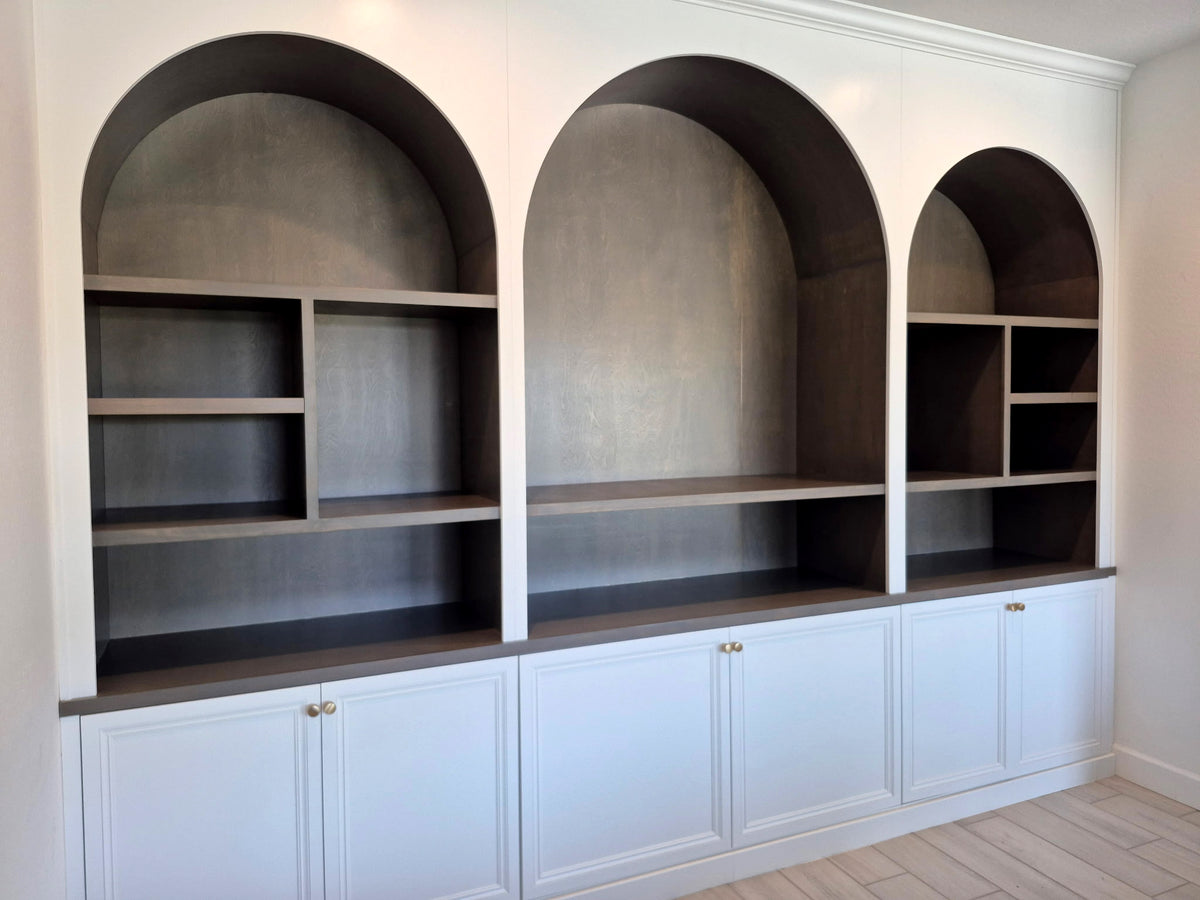 Built-in open shelving above painted lower cabinets in a completed Gentry Stinson installation
