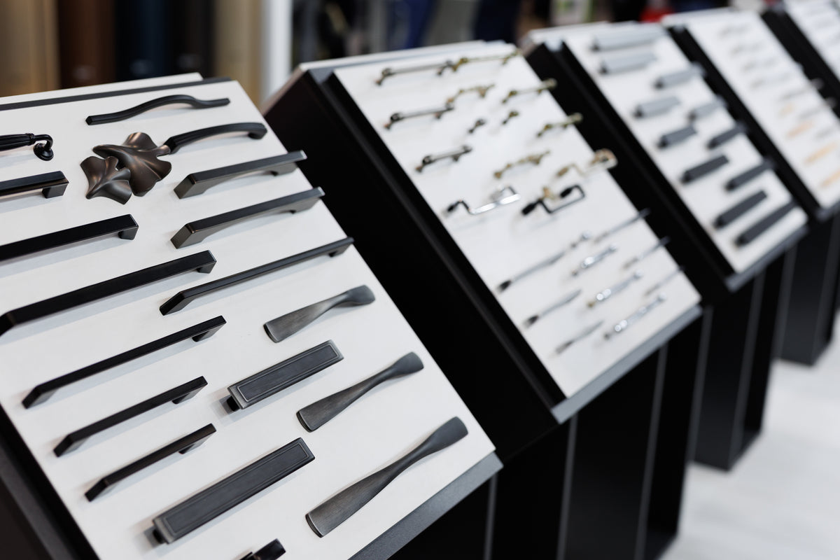 Display boards of cabinet pulls and knobs in assorted shapes and finishes