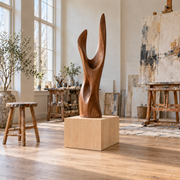 Titan Clear Alder display pedestal, 12 × 16 × 12 inches, Unfinished / Stain Ready, in a studio setting. Illustrative room scene; artwork not included.