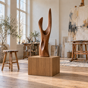 Titan Clear Alder display pedestal, 20 × 20 × 18 inches, Rubio Monocoat Castle Brown, in a studio setting. Illustrative room scene; artwork not included.