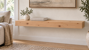 Gentry Stinson Knotty Alder Floating Shelf | 30″ long × 3″ thick | Standard Mount | Unfinished — unlit living-room rendering