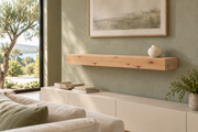 Gentry Stinson Knotty Alder Floating Shelf | 36″ long × 4″ thick | Standard Mount | Unfinished — unlit living-room rendering