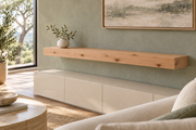 Gentry Stinson Knotty Alder Floating Shelf | 54″ long × 4″ thick | Standard Mount | Unfinished — unlit living-room rendering