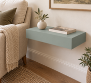 18-inch long, 3-inch thick standard painted shelf in Halcyon Green SW 6213; unlit living-room rendering.