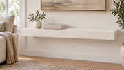 30-inch long, 3-inch thick standard painted floating shelf in Alabaster SW 7008, unlit living-room rendering.