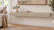 30-inch long, 3-inch thick standard painted floating shelf in Universal Khaki SW 6150, unlit living-room rendering.