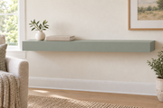 36-inch long, 3-inch thick standard-mount painted floating shelf in Halcyon Green SW 6213; representative living-room rendering; no lighting.