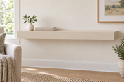 36-inch long, 3-inch thick standard-mount painted floating shelf in Natural Linen SW 9109; representative living-room rendering; no lighting.