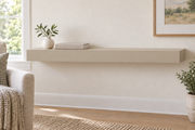 36-inch long, 3-inch thick standard-mount painted floating shelf in Universal Khaki SW 6150; representative living-room rendering; no lighting.