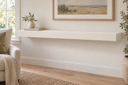 48 x 10 x 3 inch standard painted floating shelf in Alabaster SW 7008, unlit living-room rendering.
