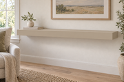48-inch long, 3-inch thick standard painted floating shelf in Universal Khaki SW 6150, unlit living-room rendering.
