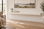 54 x 10 x 3 inch standard painted floating shelf in Alabaster SW 7008, unlit living-room rendering.