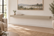 54 x 10 x 3 inch standard painted floating shelf in Universal Khaki SW 6150, unlit living-room rendering.