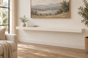 60 x 10 x 3 inch standard painted floating shelf in Alabaster SW 7008, unlit living-room rendering.