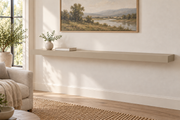 66 x 10 x 3 inch standard painted floating shelf in Universal Khaki SW 6150, unlit living-room rendering.