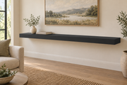 72 x 10 x 3 inch standard painted floating shelf in Tricorn Black SW 6258, unlit living-room rendering.