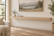 Gentry Stinson Rift White Oak Floating Shelf | 60″ × 10″ × 3″ | Standard Mount | Unfinished — unlit living-room rendering