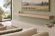 Gentry Stinson Rift White Oak Floating Shelf | 60″ × 10″ × 4″ | Standard Mount | Unfinished — unlit living-room rendering