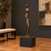 Titan 16 × 16 × 12 inch painted pedestal in Tricorn Black SW 6258, styled with artwork.