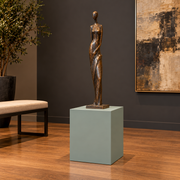 Titan 16 × 16 × 18 inch painted pedestal in Halcyon Green SW 6213, styled with artwork.