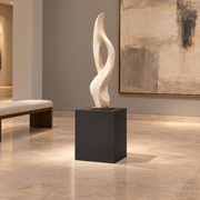 Titan 16 × 16 × 18 inch painted pedestal in Tricorn Black SW 6258, styled with artwork.