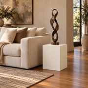 Titan 16 × 16 × 24 inch painted pedestal in Alabaster SW 7008, styled with artwork.