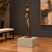 Titan 20 × 20 × 12 inch painted pedestal in Universal Khaki SW 6150, styled with artwork.