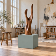 Titan 20 × 20 × 18 inch painted pedestal in Halcyon Green SW 6213, styled with artwork.