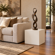 Titan 20 × 20 × 24 inch painted pedestal in Alabaster SW 7008, styled with artwork.