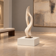 Titan 23 × 23 × 12 inch painted pedestal in Alabaster SW 7008, styled with artwork.