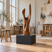 Titan 23 × 23 × 12 inch painted pedestal in Tricorn Black SW 6258, styled with artwork.