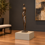 Titan 23 × 23 × 12 inch painted pedestal in Universal Khaki SW 6150, styled with artwork.