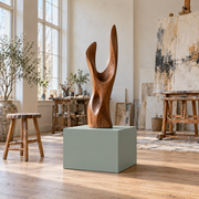 Titan 23 × 23 × 18 inch painted pedestal in Halcyon Green SW 6213, styled with artwork.