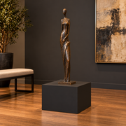 Titan 23 × 23 × 18 inch painted pedestal in Tricorn Black SW 6258, styled with artwork.