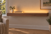 36-inch long, 3-inch thick natural walnut floating shelf, standard mount, LED-ready Top Front location shown with separately supplied lighting, living-room rendering