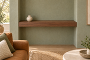 36-inch long, 3-inch thick natural walnut floating shelf, wall-to-wall mount, unlit, living-room rendering