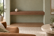 36-inch long, 4-inch thick natural walnut floating shelf, wall-to-wall mount, unlit, living-room rendering