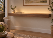 42-inch long, 3-inch thick natural walnut floating shelf, standard mount, LED-ready Top Front location shown with separately supplied lighting, living-room rendering