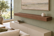 48-inch long, 4-inch thick natural walnut floating shelf, standard mount, unlit, living-room rendering