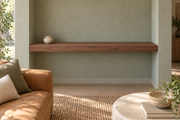 60-inch long, 3-inch thick natural walnut floating shelf, wall-to-wall mount, unlit, living-room rendering