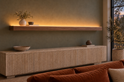 78 × 8 × 3 inch natural walnut floating shelf, standard mount, LED-ready Top Front location shown with separately supplied lighting, living-room rendering