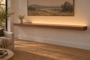 84 × 10 × 3 inch natural walnut floating shelf, standard mount, LED-ready Top Front location shown with separately supplied lighting, living-room rendering