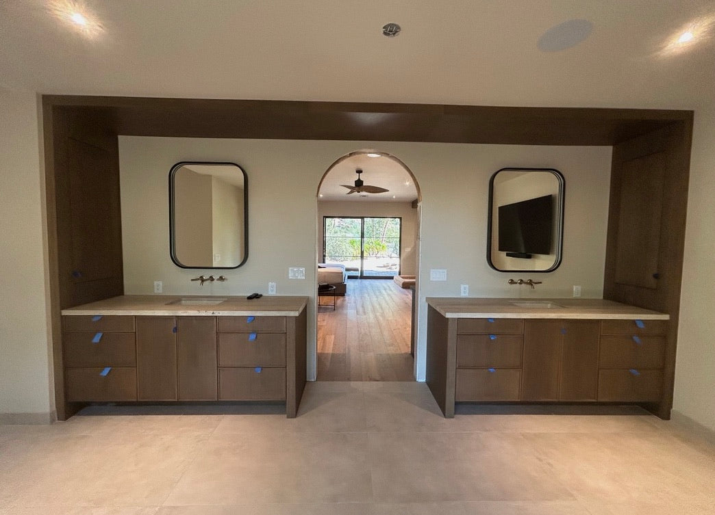 Custom double vanity wall with full-height wood surround