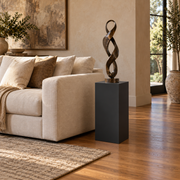 Titan painted display pedestal, 11 × 11 × 24 inches, Tricorn Black SW 6258. Styled setting; artwork not included.