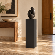 Titan painted display pedestal, 11 × 11 × 36 inches, Tricorn Black SW 6258. Styled setting; artwork not included.