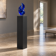 Titan painted display pedestal, 11 × 11 × 42 inches, Tricorn Black SW 6258. Styled setting; artwork not included.