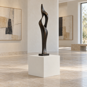 Pure White SW 7005 painted display pedestal in a gallery room with a tall sculpture; representative room rendering.