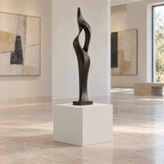 Eider White SW 7014 painted display pedestal in a 01 low gallery setting; representative room rendering.