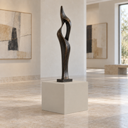 Accessible Beige SW 7036 painted display pedestal in a 01 low gallery setting; representative room rendering.