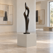Worldly Gray SW 7043 painted display pedestal in a 01 low gallery setting; representative room rendering.
